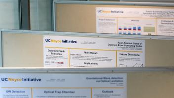 row of three bulletin boards with posters