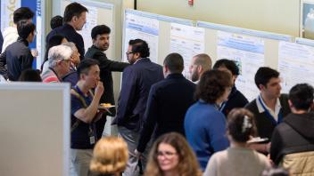 lobby full of people and research posters