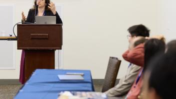 woman talks at podium