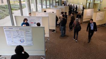 Top down view of poster session in UC Davis conference center lobby