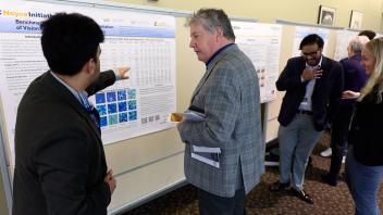 grad student talking about research with UC Davis VC