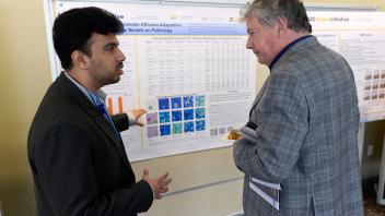 grad student talking about research with UC Davis VC