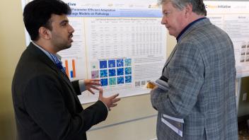 grad student talking about research with UC Davis VC