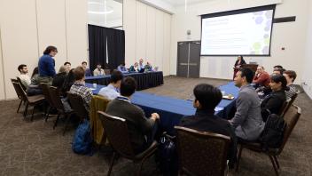 break out session people talking around u shaped table