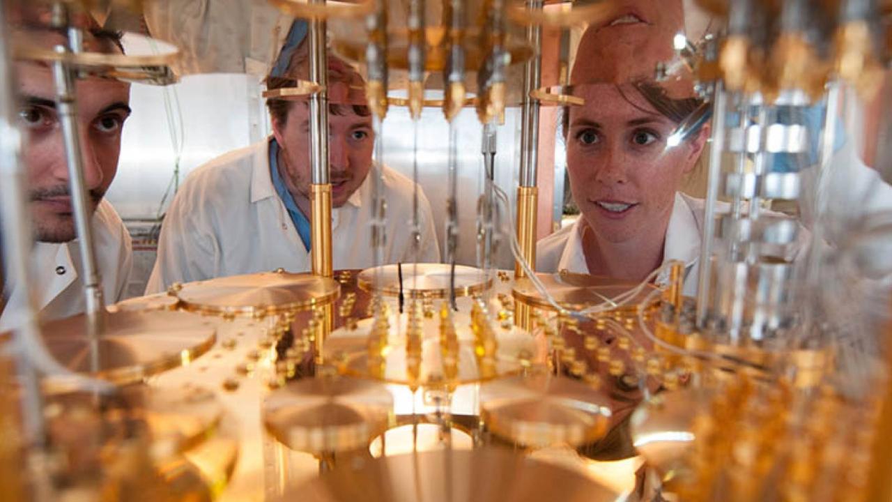Three researchers look into the inner workings of a quantum computer at UC Berkeley
