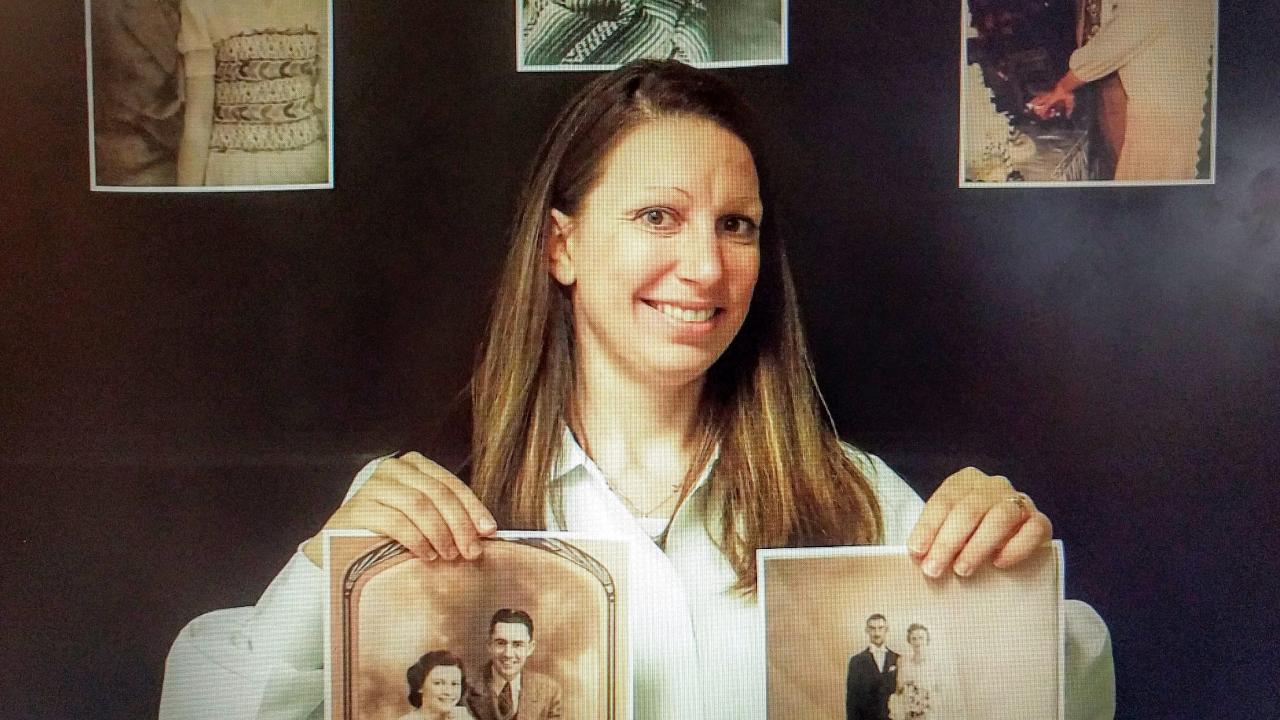 Brittany Dugger holds up pictures of her grandmothers, both of whom inspired her research.