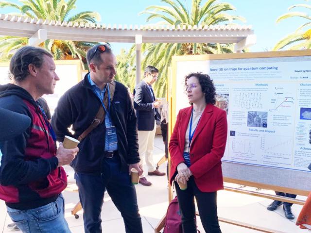 Andrew Jayich of UC Santa Barbara (center) and Marina Radulaski of UC Davis (right) discuss the latest in quantum science at the 2022 UC Noyce Symposium at UC Santa Barbara.