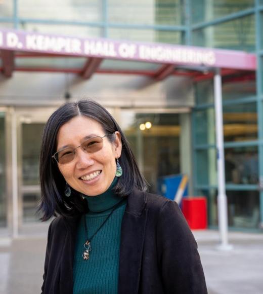 Chen-Nee Chuah stands outside Kemper Hall at UC Davis Campus