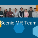 Fifteen people from the Scenic MR Team stand in a line, some people are holding virtual reality headsets, which are used for stroke rehabilitation.